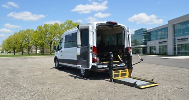 Forest River Van Wheelchair-Accessible Paratransit Ford Transit with rear lift deployed
